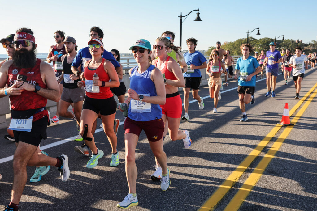 Group of runners on bridge
