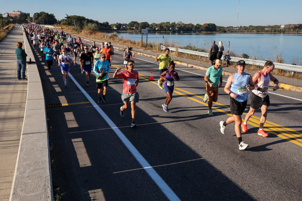 Runners crossing bridge