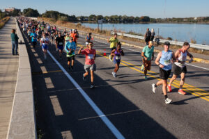 Runners crossing bridge