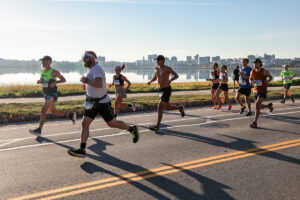 skyline behind runners